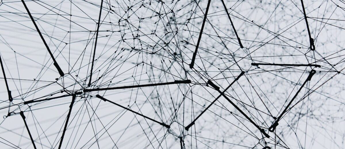 An abstract mesh of connected nodes, representing a guardrail layer that filters traffic